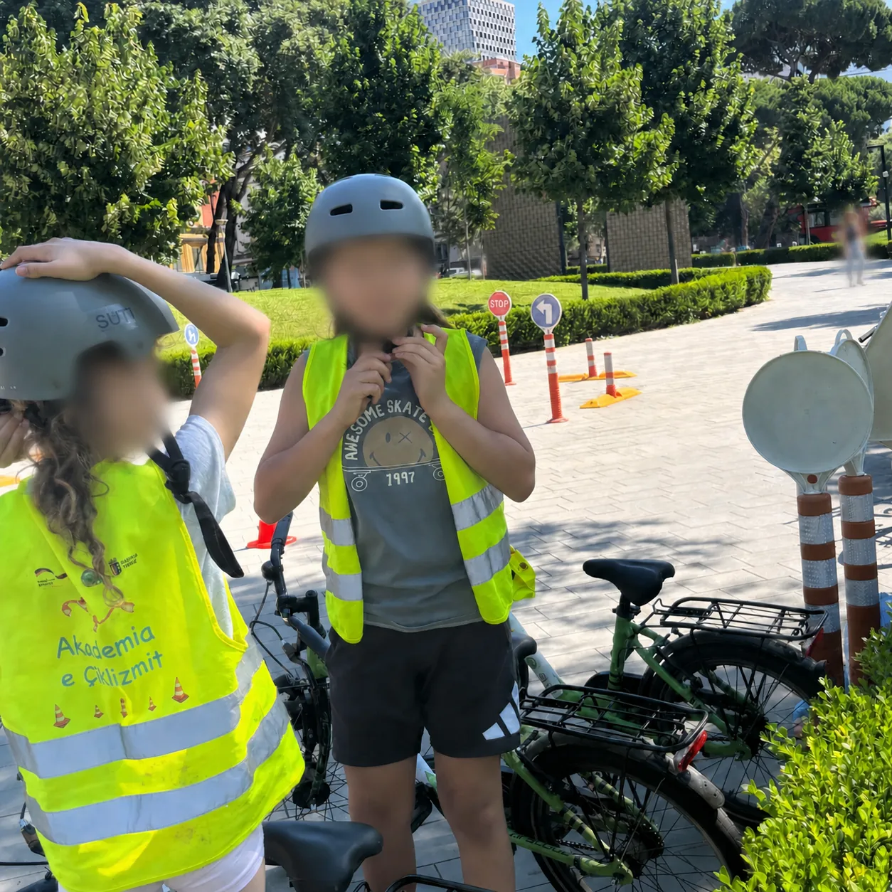 Child learning bicycle safety during a LU-EM activity in Tirana