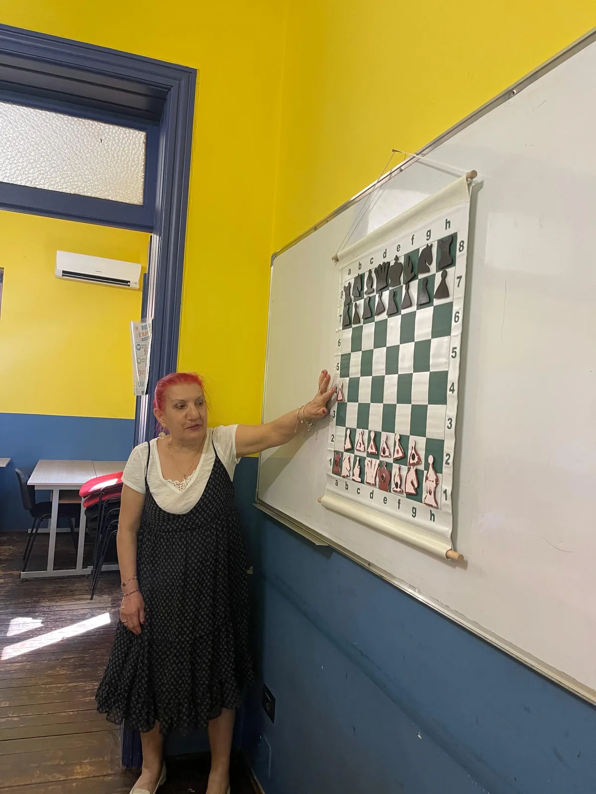 LU-EM Center educator leading a chess learning activity
