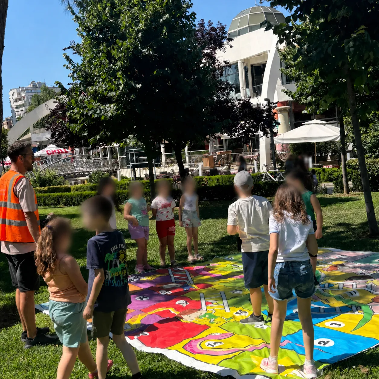 Group of children enjoying a giant outdoor game with LU-EM Center